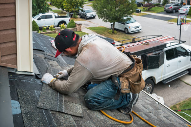 Professional Roofing technician working in Creston, IA